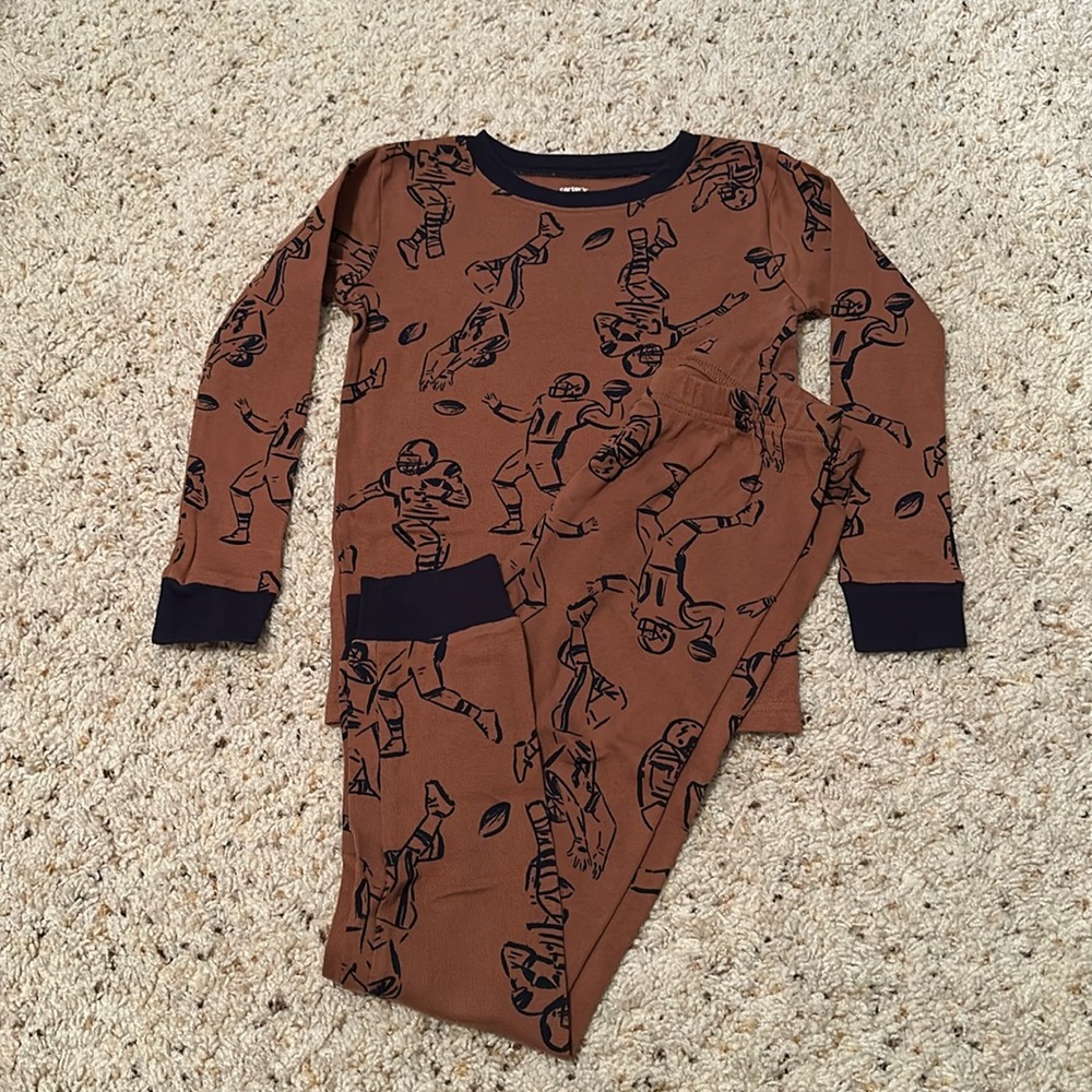 Carter’s boys size 7 football graphic print pajamas.